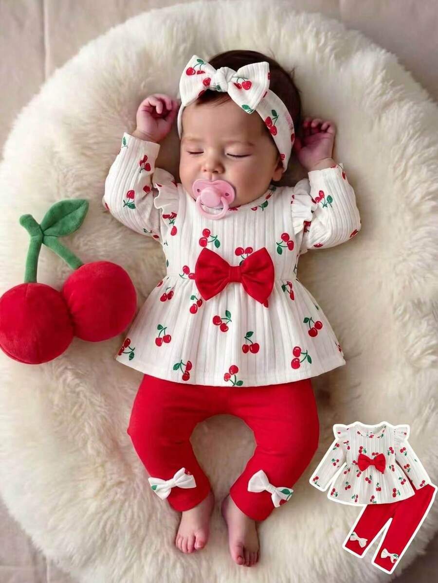 SHEIN Vintaside Kids 這套 2 件式女嬰套裝走休閒可愛甜美韓風,包含白色長袖修身上衣,飾有蝴蝶結細節與櫻桃印花圓領,搭配純紅色鬆緊腰長褲,適合秋冬日常穿著、公園野餐、遊樂園、度假、拍照及其他室內外活動 - 彩色 - 查看 1