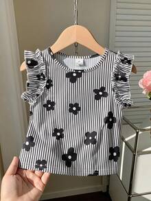 SHEIN Camiseta de manga corta con estampado floral a rayas negras y blancas para niñas & tela con rayas verticales texturizadas & diseño de manga campana & top infantil estilo coreano dulce & uso diario de verano amigable con la piel & diseño de nicho ropa infantil suave y linda - Blanco y Negro - Ver 6