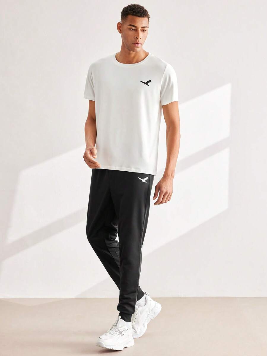 Driftmere 2pcs/Set Men's Fashion Minimalist Eagle Graphic Short Sleeve T-Shirt And Pants Set, Suitable For Streetwear, Outdoor, Vacation, And Casual Wear Gym Sport - White - View 1