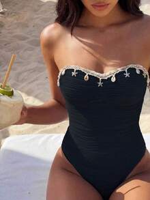 Bonvoyette Traje de baño de una pieza nuevo para mujer primavera/verano, tela texturizada con rayas de ondas azules con diseño de estrella de mar y conchas trenzadas, traje de baño de una pieza adecuado para playa, arena, natación, piscina, vacaciones - Negro - Ver 1