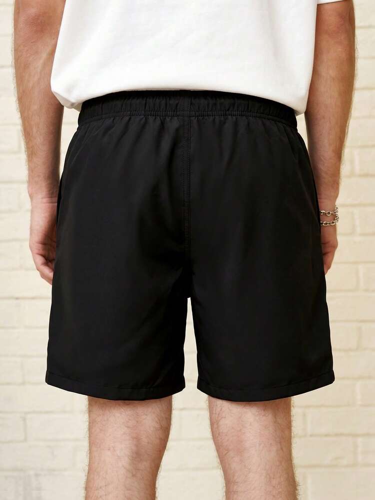 Zalmeno Pantalones casuales versátiles de playa para hombre con cintura elástica, diseño de cordón y bolsillos, unicolor - Negro - Añade 2