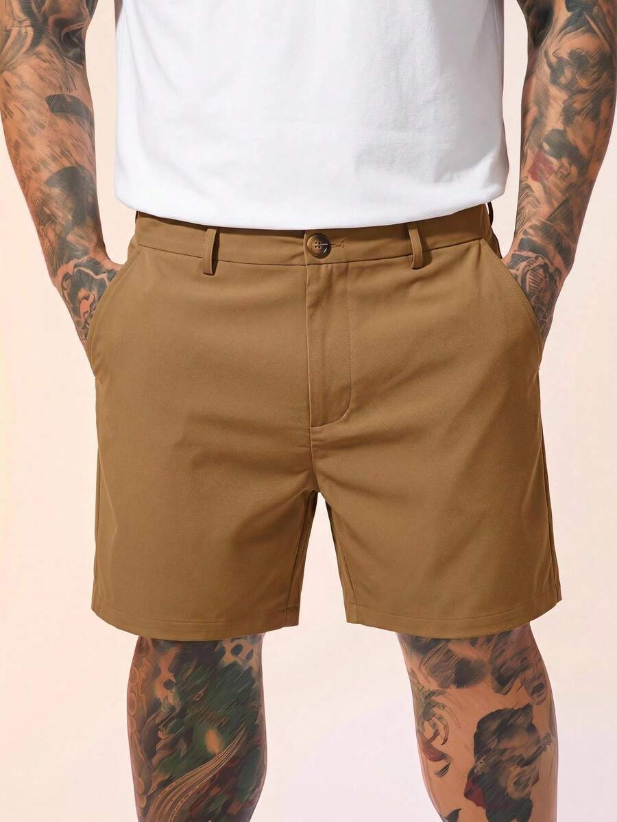 HIMLAND Pantalones cortos casuales sueltos de unicolor con bolsillo en diagonal para hombres de talla grande - Caqui - Ver 1