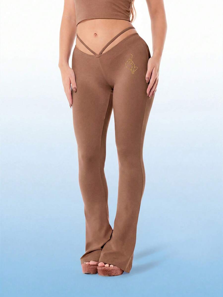 BABYPHAT Quần legging ống loe bằng vải jersey với chi tiết cắt chữ V ở eo và họa tiết cánh vàng ở lưng. - Màu nâu Sô-cô-la - Xem 1