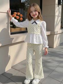 Elladie kids 2件組少女極簡通勤風波點套裝，上衣採一體式2合1結構襯衫，小翻領、收口袖，領口飾細黑蝴蝶結，外層波點短版細肩帶背心，搭配同布料喇叭長褲，俐落修身，微薄，適合校園、日常穿著、逛街、公園穿搭 - 杏色 - 查看 11