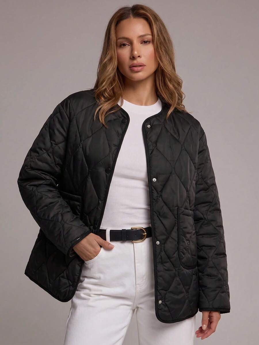 Abrigo acolchado con doble bolsillo con botón delantero - Negro - Ver 1