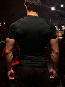 GymBeat Camiseta deportiva de manga corta con estampado de letras y mangas raglán para hombre, gimnasio - Negro - Ver 2