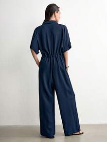 Aalyst Jumpsuit Wanita Musim Semi/Panas Warna Biru Tua Bahan Linen Twill dengan Kerah Kancing Depan, Minimalis, Kasual, Elegan, Longgar, dan Ramping, Cocok untuk Kerja dan Perjalanan - Navy Blue - View 3