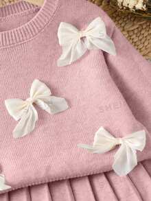 SHEIN Playful Pals 女童燕麥色手工歐根紗蝴蝶結圓領落肩長袖套頭針織衫 + 成套百褶裙，柔軟舒適，適合日常穿著、外出、旅行、度假、居家、托兒所與玩耍 - 粉色 - 查看 6
