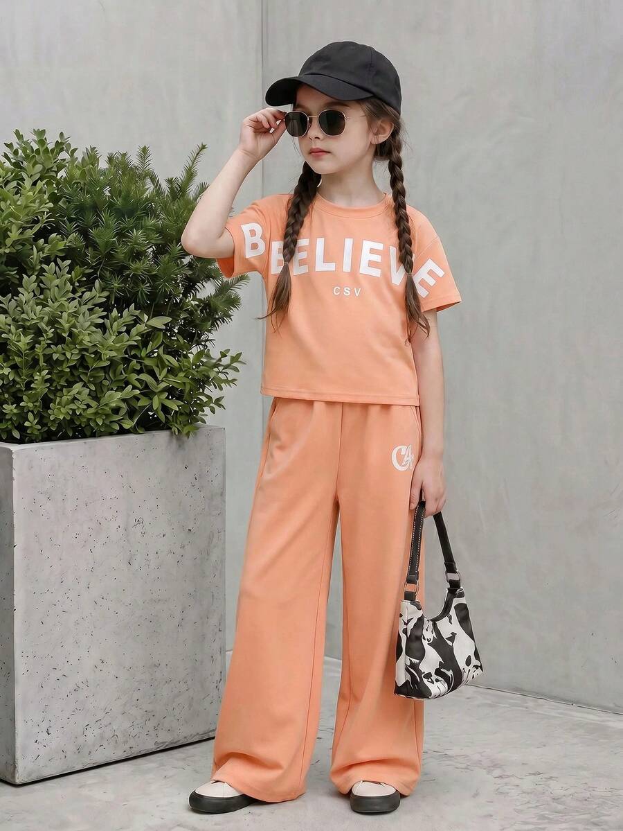 Casuvi Kids 女童休闲运动套装,宽松圆领T恤搭配休闲裤,蜜桃色增添青春活力,面料柔软亲肤,适合日常休闲穿着、上学和度假。 - 珊瑚粉 - 查看 1