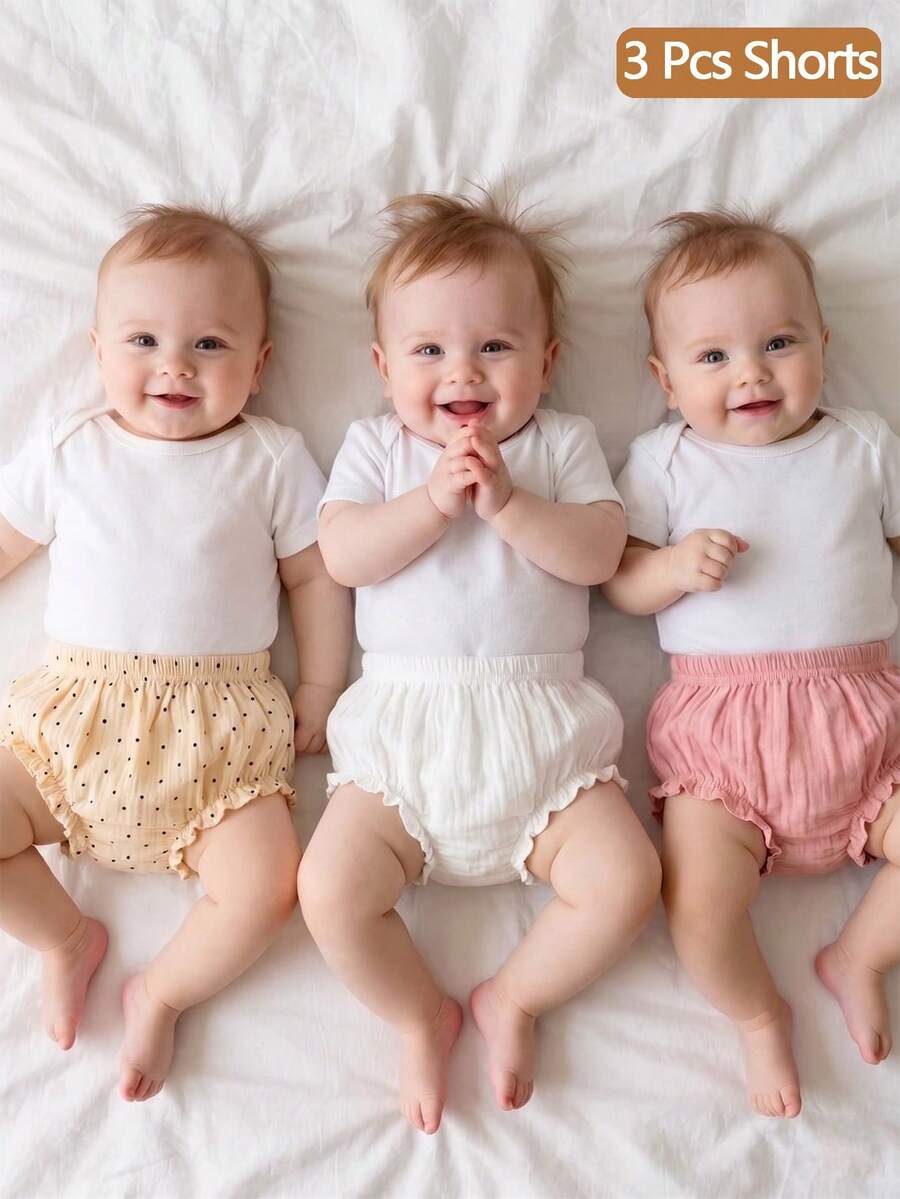 SHEIN 3件套新生女宝宝可爱柔软小裤子套装，采用精选棉质泡泡绉纱面料，粉色、黄色波点和米色可选，配有弹性腰带和荷叶边裤脚，适合拍照、搭配服装以及春夏休闲穿着，专为0-9个月的女宝宝设计。