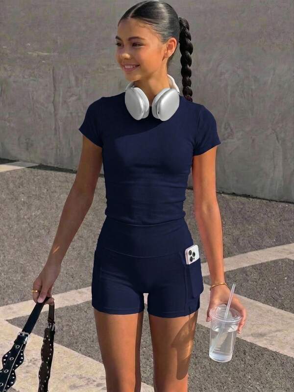 SHEIN Conjunto deportivo versátil y cómodo para niña preadolescente, estilo casual diario, para tenis y yoga, top dulce de manga corta con shorts con bolsillo lateral, atuendo atlético