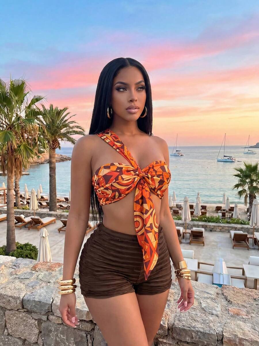Slaydiva Ladies Two Pieces Set, Orange And Black Baroque Checkered One Shoulder Wrap-Around Sash Blouse Chocolate Brown Pleated Hot Pants, Summer Sexy Beach