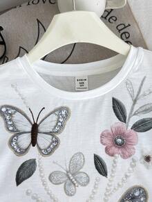 SHEIN 青少年女孩夏季時尚 T-Shirt 套裝，休閒極簡寬鬆圓領短袖 T-Shirt 與寬鬆短褲 2 件套，適合日常穿著與返校穿搭 - 白色 - 查看 6
