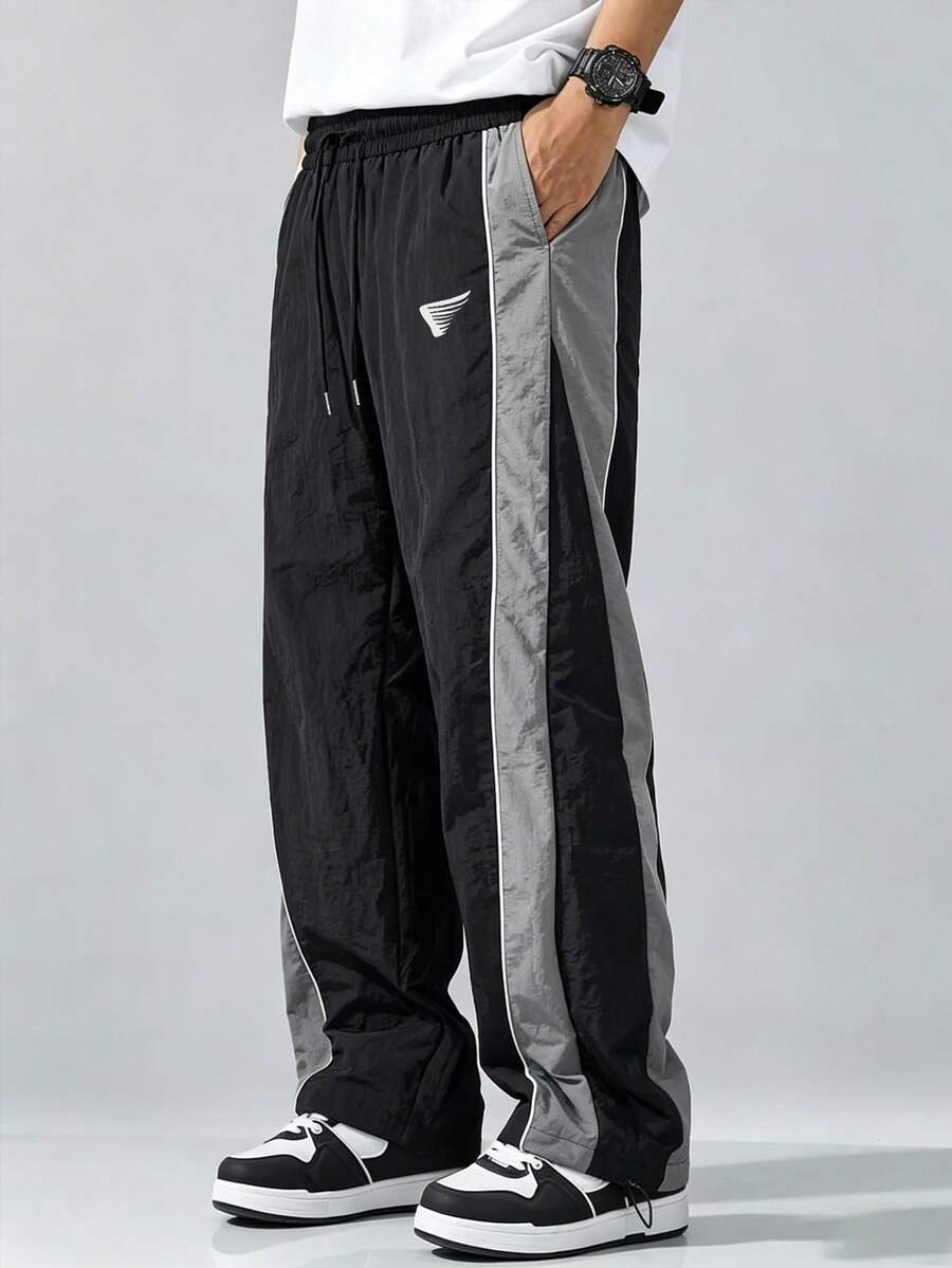 Sport MetroGents Pantalones deportivos largos para hombre con cintura de cordón y color contrastante - Negro - Ver 1