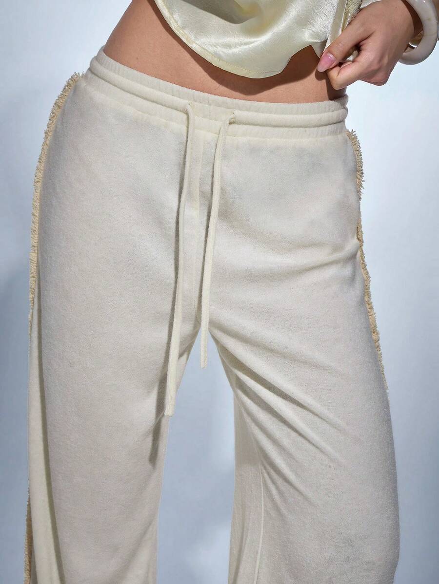 MERLEAU Calças compridas casuais de moda moderna para mulher, em tecido de toalha branco, com design de bainha desfiada e efeito desgastado - Bege - View 1