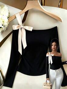 Selianne Camiseta de mujer nueva primavera/otoño con hombros descubiertos, manga larga, de punto, cintura elástica, ajuste ceñido, con lazo de color contrastante, diseño francés elegante y exquisito - Negro - Ver 1