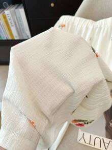 GlowEve CURVE 大尺碼優雅花卉刺繡對比色寬腿褲，彈性腰頭，適合日常通勤、外出、派對、度假 - 杏色 - 查看 4