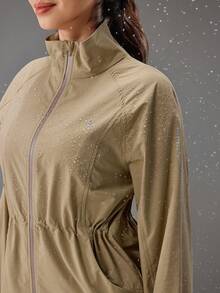 OutZeal Chaqueta para mujer para exteriores, entrenamiento y uso diario, con cuello alto, cintura con cordón y bolsillos con cremallera - Caqui - Ver 7