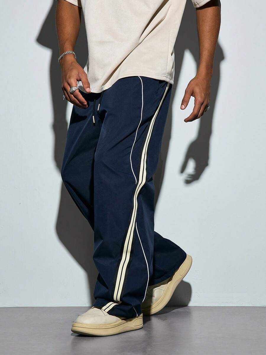 Modcrash 1pc Fashionable Sporty Casual Straight Leg Loose Wide-Leg Pants, Featuring Stylish Ribbed Tape Inserts, Contrast Binding Design, Lightweight Polyester Fabric, Suitable For Gym Wear And Gift - Navy Blue - View 1