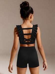 SHEIN Conjunto de pantalones cortos deportivos para niñas jóvenes, diseño con volantes y espalda descubierta, lazo cruzado multicapa con huecos en la espalda, pantalones cortos de cintura alta, top corto ajustado, adecuado para danza, fitness, actuaciones, uso diario al aire libre, atuendo casual - Negro - Ver 1