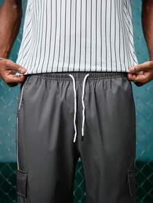 EVRINFINITE Pantalon cargo ample à taille avec cordon de serrage, coutures contrastées et poches multiples. Style décontracté à la mode de la rue, convient pour le port quotidien au printemps/automne - Gris foncé - Voir 4