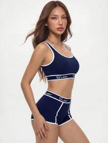 Rina Fox Set de lencería deportiva con sujetador de bloques de color y ribete de contraste y boxers cortos para yoga - Azul - Ver 8