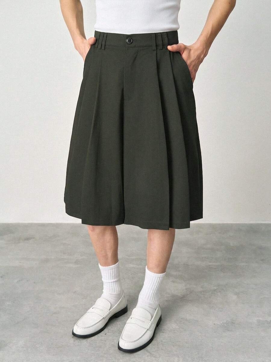 STYNVO Pantalones capri de moda para hombre de unicolor con pliegues, botones y bolsillos - Verde Oscuro - Ver 1