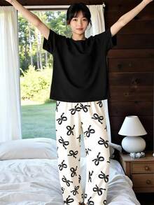 青少年女孩夏季蝴蝶結印花極簡針織圓領時尚新款黑色短袖上衣搭配滿版蝴蝶結印花長褲休閒舒適兩件套家居服 1套 - 黑色 - 查看 4