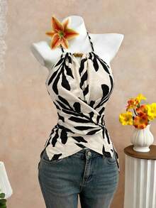 GlowEve CURVE Women's Spring/Summer Elegant Commuter Casual Apricot Leaf Print Sleeveless Halter Neck Bow Tie Neckline Wooden Bead Decor Asymmetrical Hem Waist Cross Tie Design Fitted Slimming Tank Top - Black - View 4
