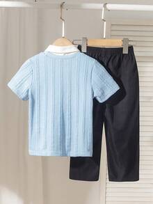 2pcs/Set Boys Outfit, Textured Navy Blue Knit Sweater With Small Black Embroidered Pattern On Left Chest, Khaki Pants, Suitable For Commuting, Casual Wear, Spring/Summer - Multicolor - View 2