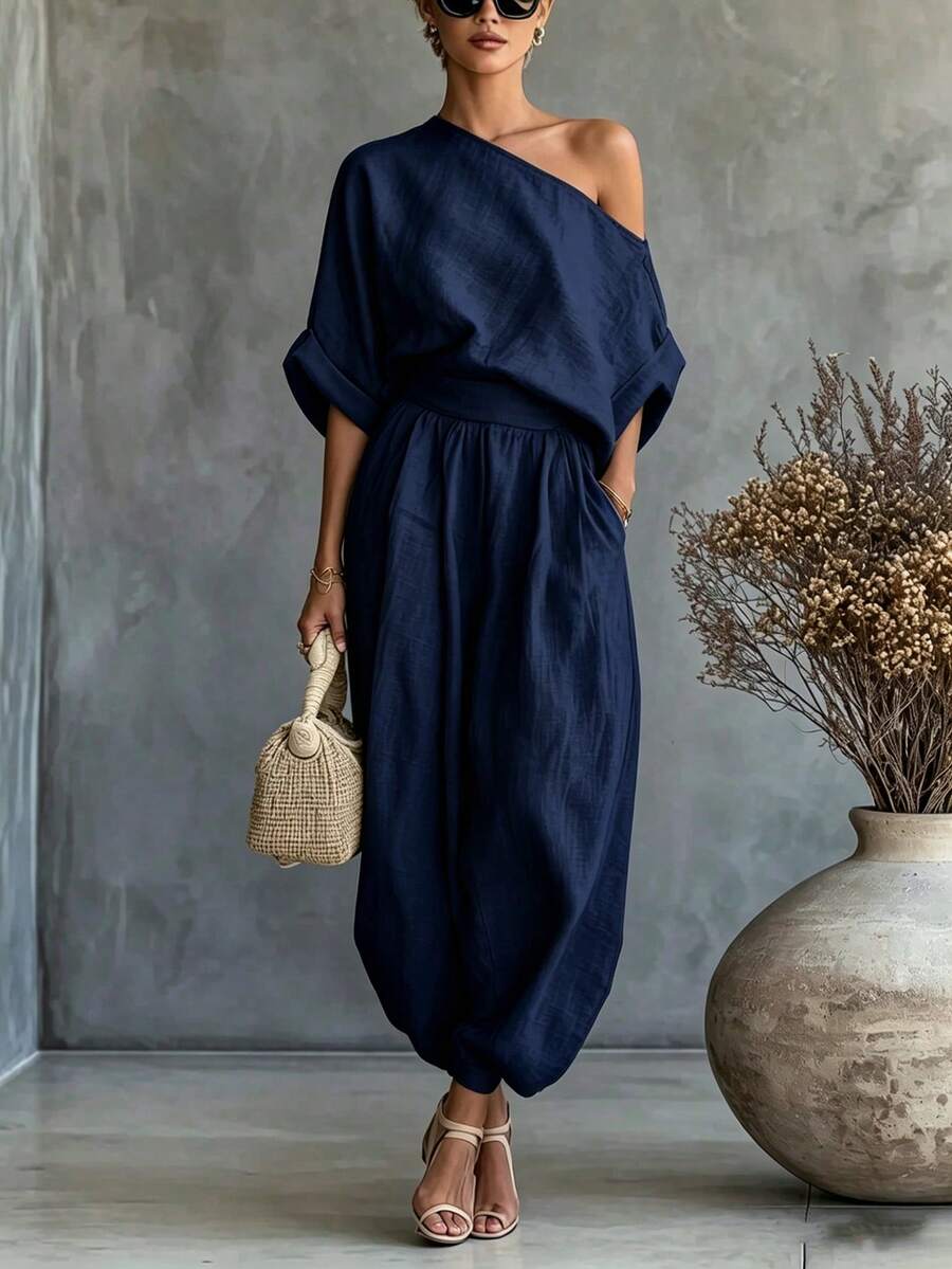SHEIN Fiorisel طقم نسائي كاجوال يومي بلون موحد مع ملابس علوية بكتف غير متماثل وبنطلون طويل - أزرق بحري - مشاهدة 1