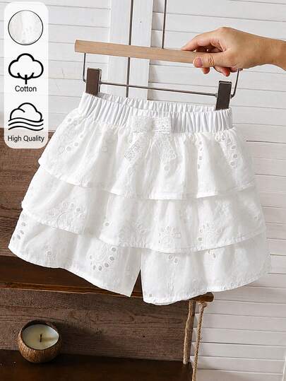 SHEIN Young GirlvWhite Cake Layer Skorts, Hollow Embroidery Cotton Fabric, Three-Layer Ruffle Hem With Layered Design, Gentle And Ethereal. Loose Elastic Waistband With Exquisite Lace Bow, Built-In Shorts For Anti-Exposure, Suitable For Daily Wear And Travel Photography, Full French Country Girl Style