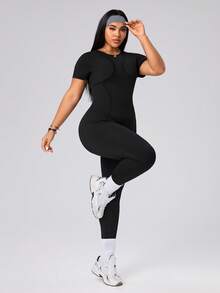 SHEIN Rhythm Era Spring Summer Plus Size Women's Sports Jumpsuit, Round Neck Short Sleeve, Front Split Seam, Back Cutout With Buckle, 9/10 Length, Black, Slim Fit - Black - View 5