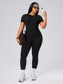SHEIN Rhythm Era Spring Summer Plus Size Women's Sports Jumpsuit, Round Neck Short Sleeve, Front Split Seam, Back Cutout With Buckle, 9/10 Length, Black, Slim Fit - Black - View 6