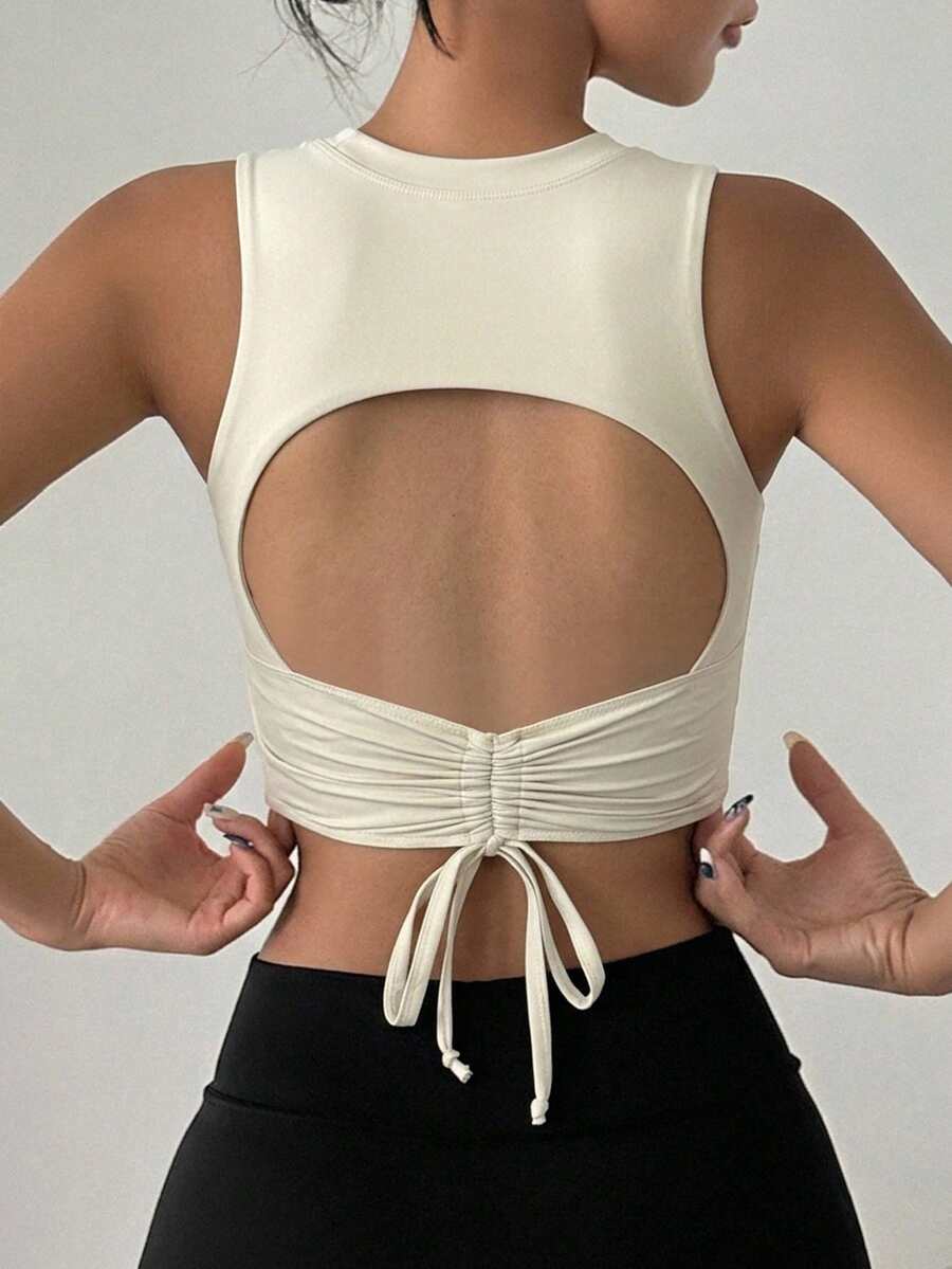 DAZY Women's Sleeveless Solid Color Ruched Back Hollow Out Sports Bra With Padded Cups - Beige - View 1