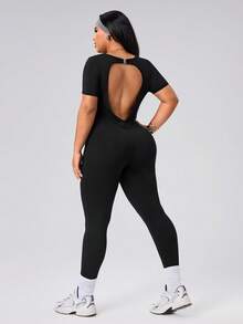 SHEIN Rhythm Era Spring Summer Plus Size Women's Sports Jumpsuit, Round Neck Short Sleeve, Front Split Seam, Back Cutout With Buckle, 9/10 Length, Black, Slim Fit - Black - View 2