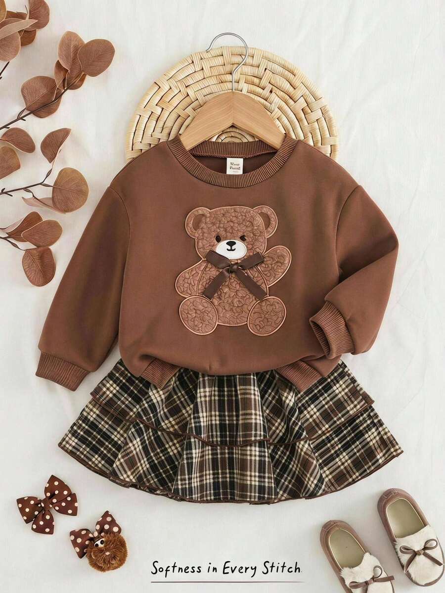 Cozy Pixies 女童嬰兒可愛蝴蝶結小熊圖案圓領長袖套頭運動衫彈性腰格紋裙套裝,百搭時尚優雅休閒簡約都市校園基礎裙裝,適合秋冬室內/戶外休閒、返校、日常運動、玩耍、假期派對等多種場合,日韓歐美風 - 彩色 - 查看 1