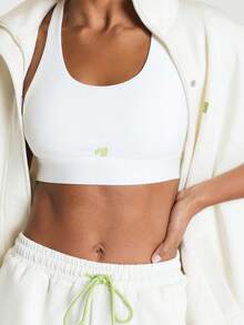 11SKNDS Glideform Racerback Sports Bra With Scoop Neck Seamless Slip-On Design And Logo Detail For Active Training - White - View 6
