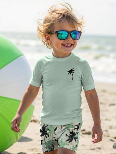SHEIN Young Boy Casual Loose Fit Round Neck Short Sleeve T-Shirt And Shorts Swimwear Set,Palm Tree Tropical Leaf Print,Perfect For Summer,Beach,Holiday