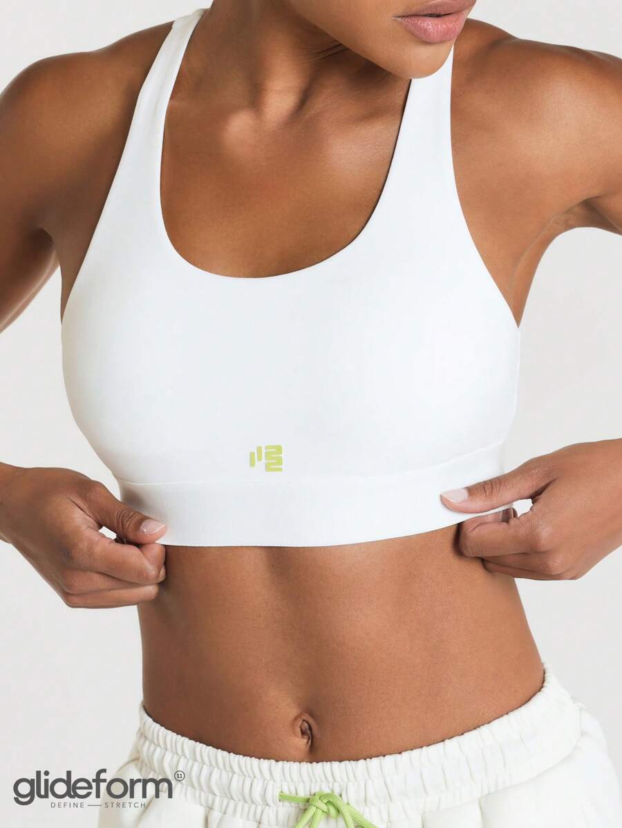 11SKNDS Glideform Racerback Sports Bra With Scoop Neck Seamless Slip-On Design And Logo Detail For Active Training - White - View 1