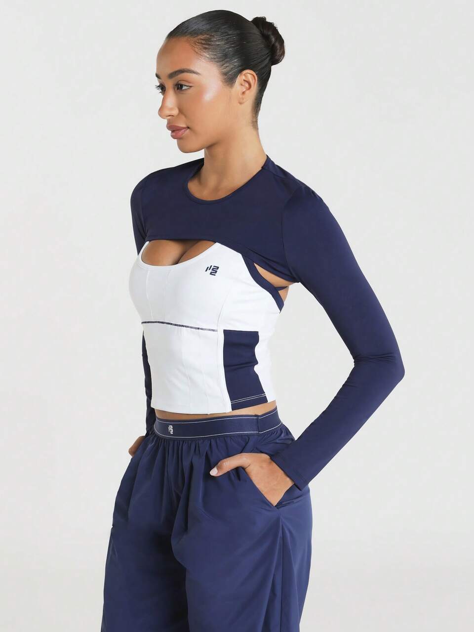 11SKNDS Long Sleeve Crop Top With Cutout Detail, Color Block Design, Corset-Style Bodice, Round Neck, Layered Look, Contrast Stitching, Casual Street Style