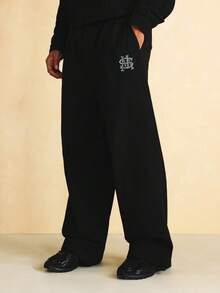 SUMWON Wide Leg Nylon Textured Jogger Pants With Monogram Embroidery Logo Detail And Elastic Waistband - Black - View 4