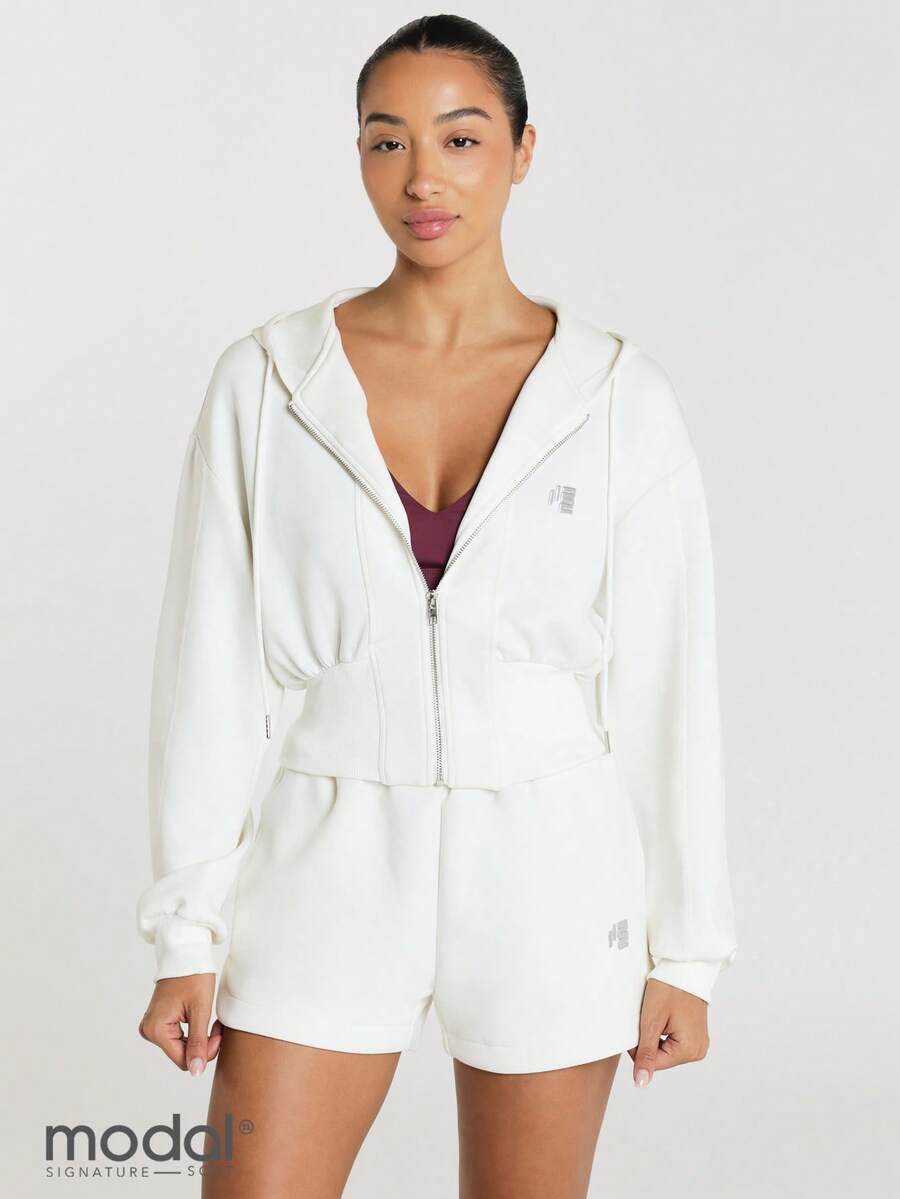 11SKNDS Áo nỉ croptop dáng rộng kéo khóa với khóa kéo bạc, vai trễ, đắp logo, món đồ layer cơ bản thường ngày, thấm hút mồ hôi và mềm mịn như bơ, dành cho tập gym, thể hình, chạy bộ, tập luyện và Hy-Rox - trắng - Xem 1