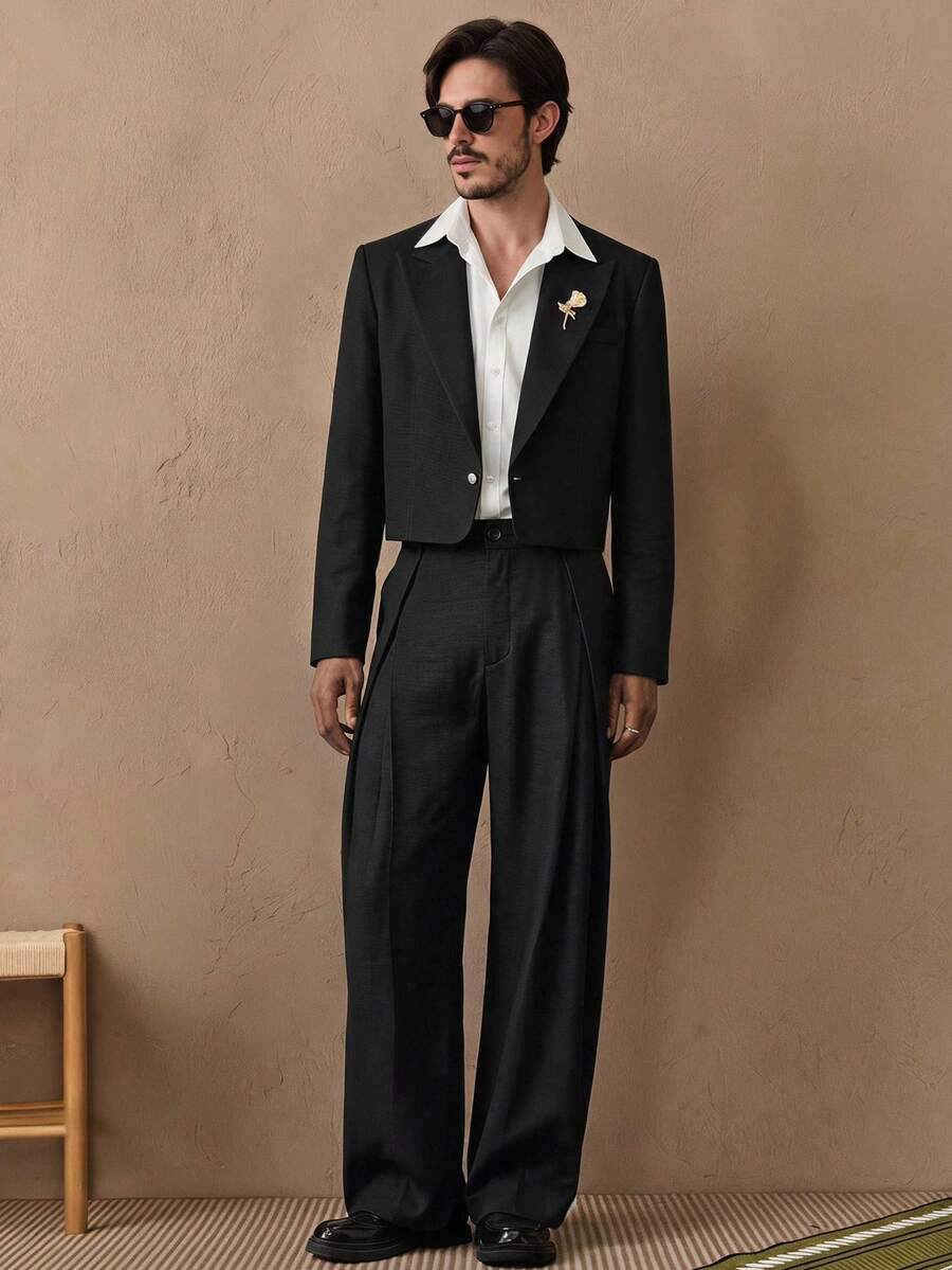 HIMLAND Bộ 2 món nam dệt thời trang casual trẻ trung dáng rộng áo blazer dài tay và quần ống đứng lưng thun - màu đen - Xem 1