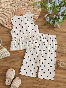 SHEIN Vintaside Kids 2件組女嬰套裝，經典奶油色底色配黑色圓點印花，無袖荷葉邊下擺上衣搭配雙層緞面黑色蝴蝶結，配對寬鬆寬腿褲，平滑輕盈親膚面料，適合日常玩耍、外出與拍照，柔美甜美小女孩穿搭 - 白色 - 查看 2