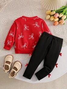 SHEIN 2件組女嬰套裝，紅色滿版白色蝴蝶結圖案運動衫，搭配黑色3D紅色蝴蝶結長褲，柔軟面料，寬鬆版型，舒適適合日常穿著、節日聚會與拍照，甜美風格適用於嬰兒與女嬰 - 紅色 - 查看 2