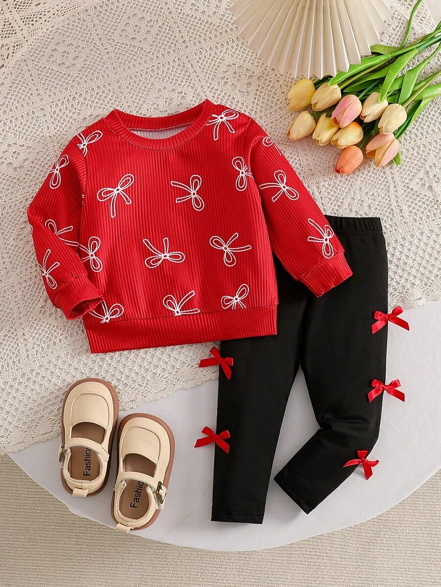 SHEIN 2pcs/Set Baby Girl Outfit, Red Sweatshirt With All-Over White Bow Pattern, Paired With Black Pants With 3D Red Bow, Soft Fabric, Loose Fit, Comfortable For Daily Wear, Holiday Gatherings And Photo Shoots, Sweet Style For Infant And Baby Girl - Red - View 1