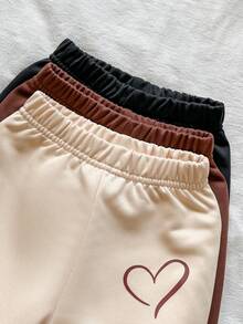 SHEIN Vintaside Kids 女嬰秋冬針織休閒韓系日常基礎百搭三色組合彈性腰收口長褲三件套，褲側飾有簡約鏤空愛心印花圖案，適合居家休閒、戶外活動、秋季出遊、生日派對及各種節日場合 - 彩色 - 查看 3