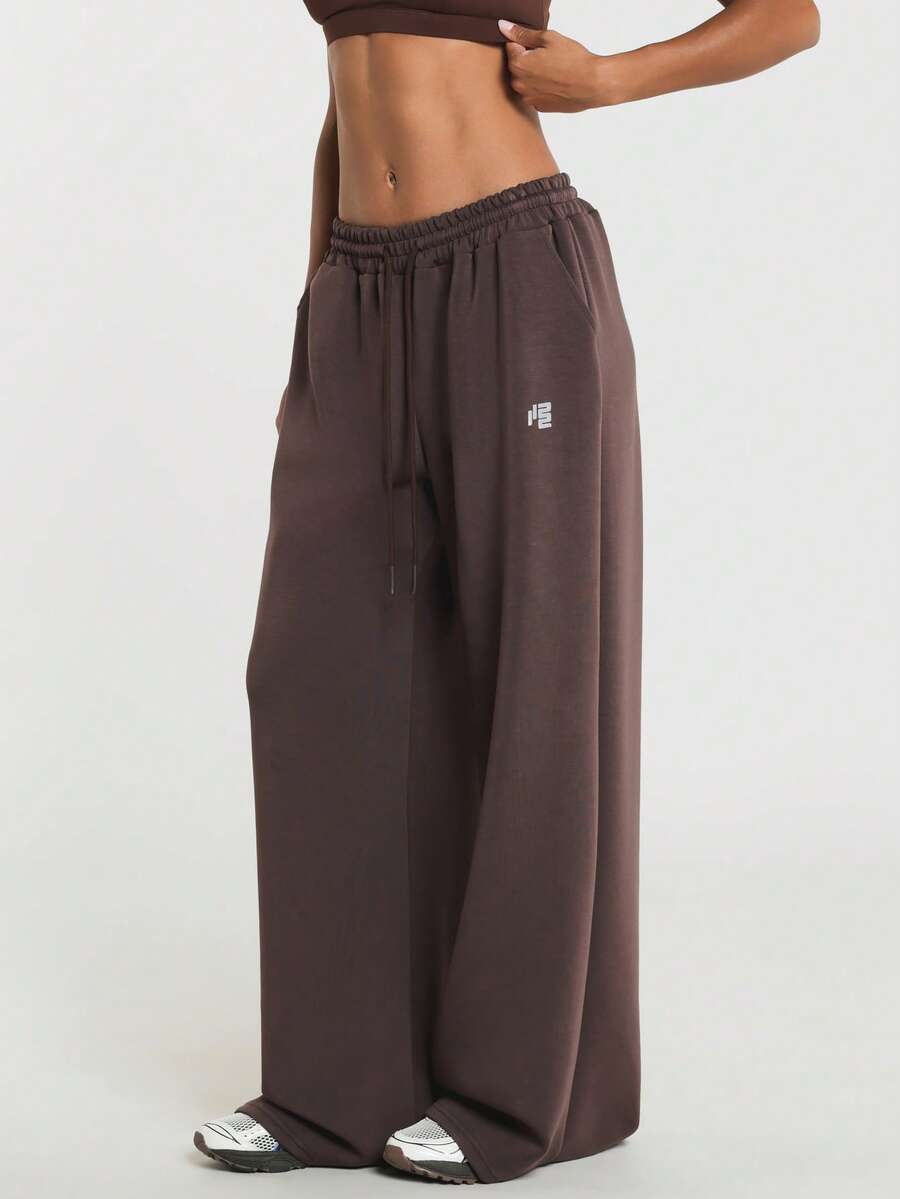11SKNDS Wide Leg Sweatpants With Elastic Drawstring Waist, Relaxed Fit Fleece Joggers, Side Pockets, Small Logo Detail, Casual Everyday Comfort Pants - Brown - View 1
