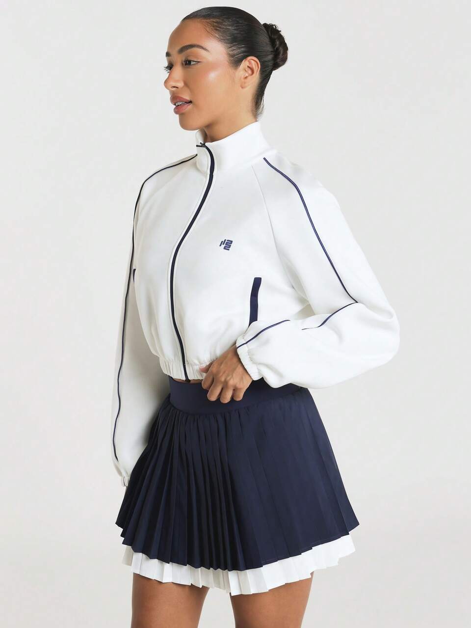 11SKNDS Cropped Mock Neck Full Zip Track Jacket With Contrast Piping Trim, Elasticated Hem, Chest Logo, Long Sleeves, Autumn Back-To-School Gym Cream White